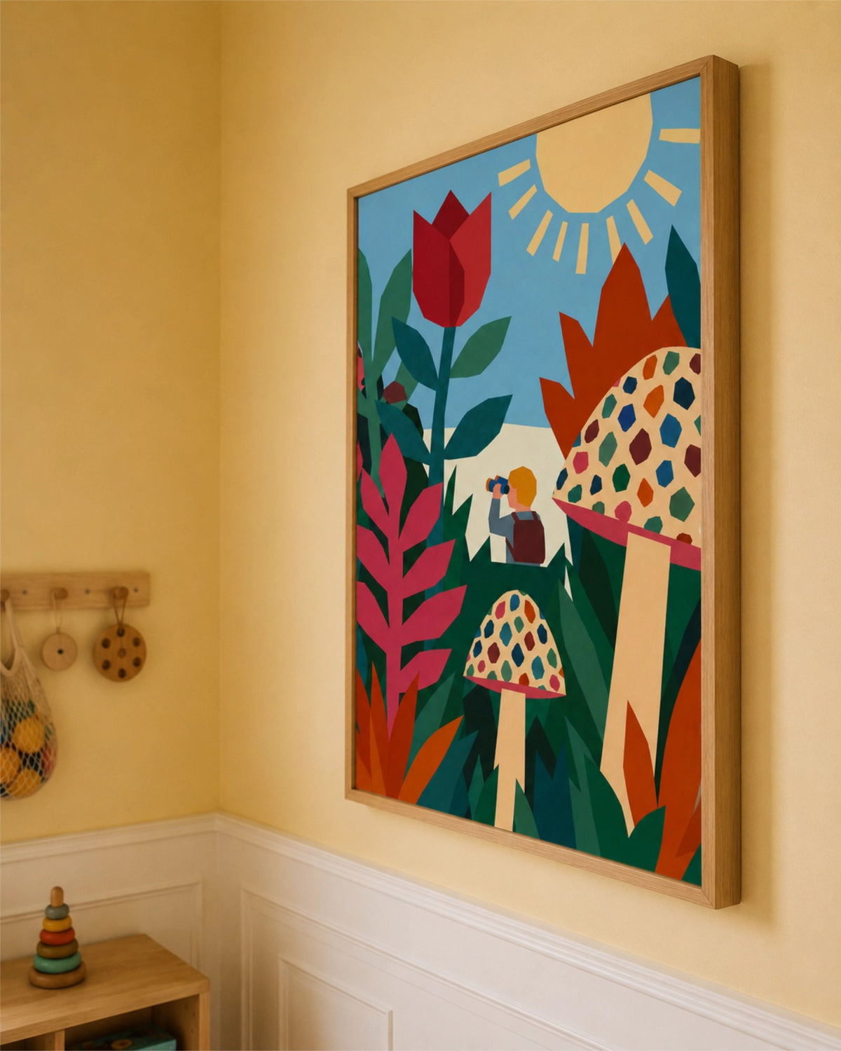 Close-up of the Field Trip art print in a natural wood frame, showing geometric flowers, patterned mushrooms and a small explorer.
