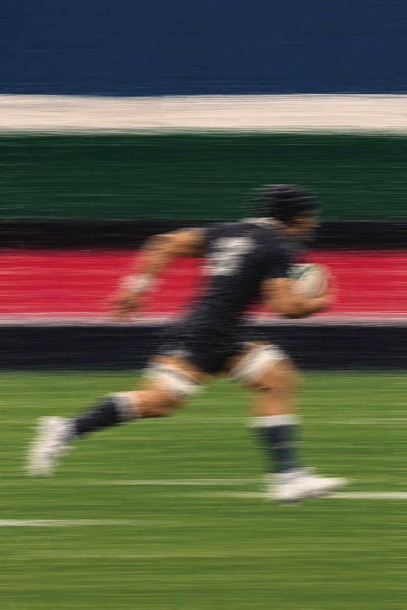 Line Break art print featuring a rugby player sprinting with the ball through bold horizontal colour bands with heavy motion blur.