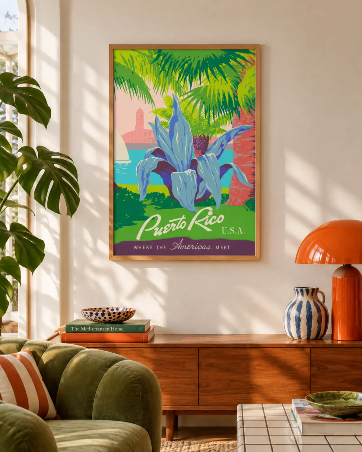 Discover Puerto Rico vintage travel poster in a natural wood frame above a walnut console in a sunlit living room.